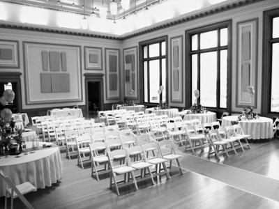 Rows of white chairs set for a wedding ceremony in the Ballroom