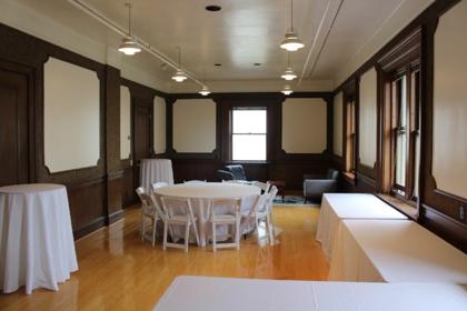 The Parlor set with round tables for a daytime event