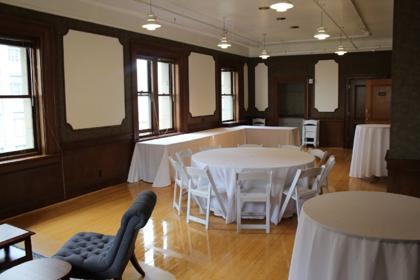 The Parlor set with rectangular tables and a small presentation area